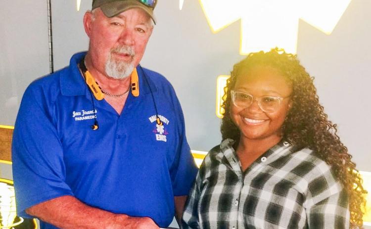 Hall County Emergency Medical Services (EMS) Paramedic Jace Frances awards Mikayla Ledbetter the David Eades Memorial Scholarship. A 2024 graduate of Memphis High School, Ledbetter’s mother, Lasonya McIntosh, has served with the Hall County EMS for over 22 years. Recently, Ledbetter graduated from Clarendon College, where she earned an associate’s degree. Next, Ledbetter plans to attend Covenant School of Radiology. HALL COUNTY EMS