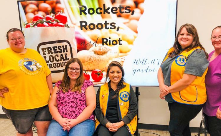 Lion Lindsay Hill, left, is joined by a group of women who have designed a plan for a community garden, including Jaci Roberson, Lion Noemi Pena, Lion Kassidy Barlow and Katy Sorenson. The Rockets, Roots and Riot PowerPoint presentation described the components of the project during the Monday, Aug. 18 meeting of the Wellington Lions Club. The Red River Sun/Bev Odom