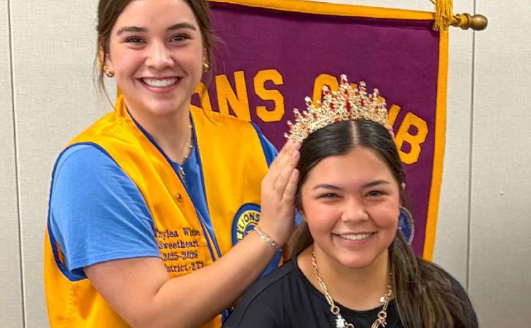 Outgoing Wellington Lions Club Sweetheart Treylea Wiebe crowns the new sweetheart, Kaycee Martinez, during the Monday, June 1 meeting. The Rocket Leo Club provided the crown. Martinez will begin her reign at the Monday, July 6 meeting. BEV ODOM/THE GREENBELT INTREPID