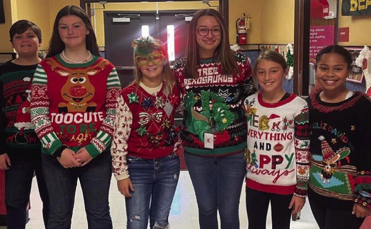 Cabbell, Peters claim Wellington Elementary ugly sweater contest prizes