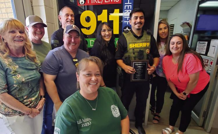 The Hall County Sheriff’s Office, including Hall County Sheriff Tom Heck, bids Hall County Sheriff’s Deputy Sergio “Baby Serg” Romero “goodbye,” bestowing him with an Appreciation Award, as he prepares to attend the Texas Department of Safety (DPS) Training Academy. Courtesy Photo
