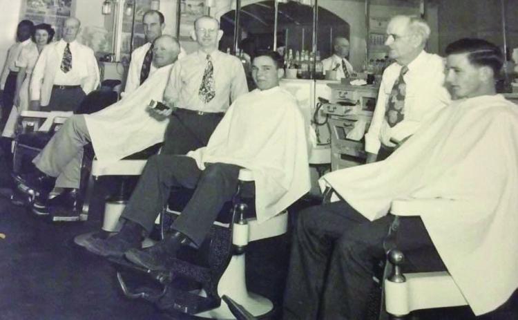 Popeye stands in the back of a photo taken at Greenhaw’s Barber and Beauty Shop in 1942. Photos Courtesy of the Collection of John R. Ballew