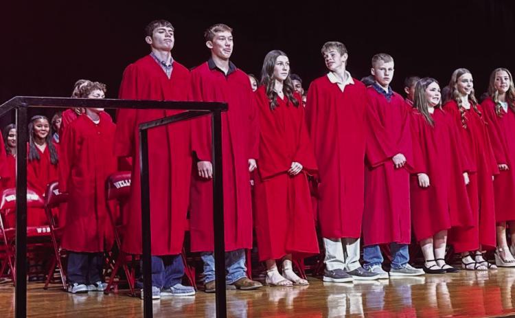 Wellington Junior High School Principal Shannon Fisher, left, presents the eighth-grade class to receive their diplomas on the stage of Wellington High School auditorium Thursday afternoon, May 15. Wellington Independent School District Board Trustee Jonathan Killian assisted Fisher in presenting the diplomas. Front row, from left: honor students Jimmy “Jax” Cantu, Cix Killian, Anna Dwyer, Damon Keys, Miles Ouellette, Ava Peters, Libby Chandler, Gannon Guy, Autumn Shatswell, Elvis Jaimes. Shari Davis