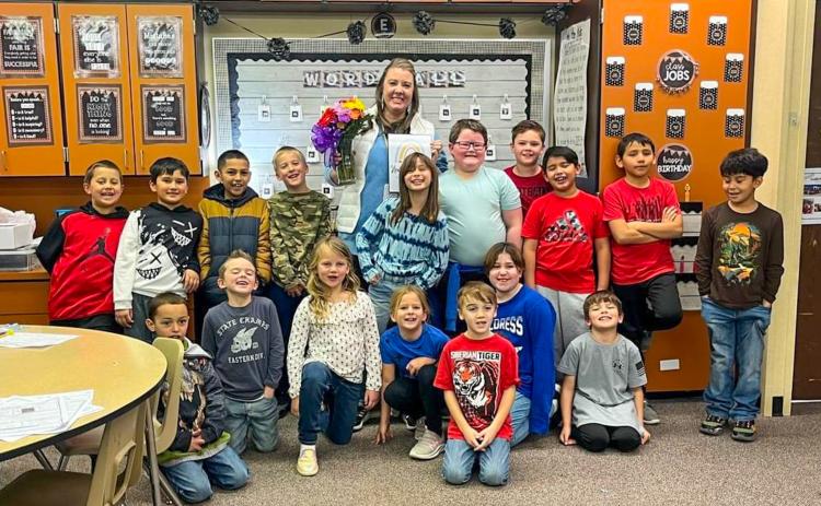 Childress Elementary School second-grade teacher Heather Overmiller, surrounded by her students, accepts Childress Elementary Teacher of the Year. Photos Courtesy of Childress Elementary School