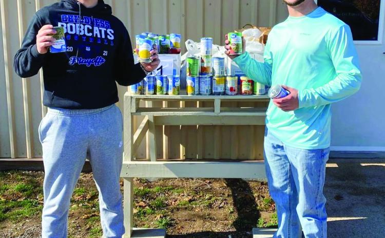 Childress High School (CHS) students Reid Felton and Nick McMinn deliver canned food drive contributions to Childress Meals on Wheels. The donations were collected through CHS student council’s canned food drive competition, which was won by the sophomore class, which will be rewarded with a movie at the Palace Theater. Childress High School thanks United Supermarkets and United Supermarkets Manager Justin Pierce for their donations. Photo Courtesy of Childress High School