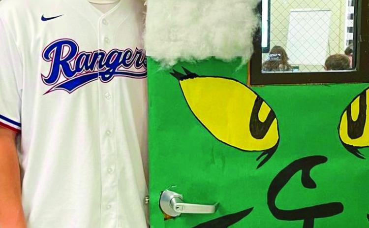 Childress High School (CHS) Family, Career and Community Leaders of America (FCCLA) members, including sophomore Kaleb Mayden, festively decorate the classroom doors of CHS. Photos Courtesy of Childress High School