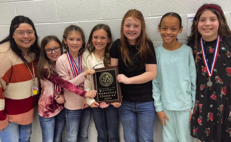 Katelynn Molina, Wellington Elementary School fourth-grade teacher, congratulates her students for their December District UIL Academic Meet achievements. From left: Molina, Briley Holton, Peyton Roberson, Raylie Sims, Piper Barnes, Alaeja Archie and Callahan Cantu. Photos Courtesy of Wellington Elementary School