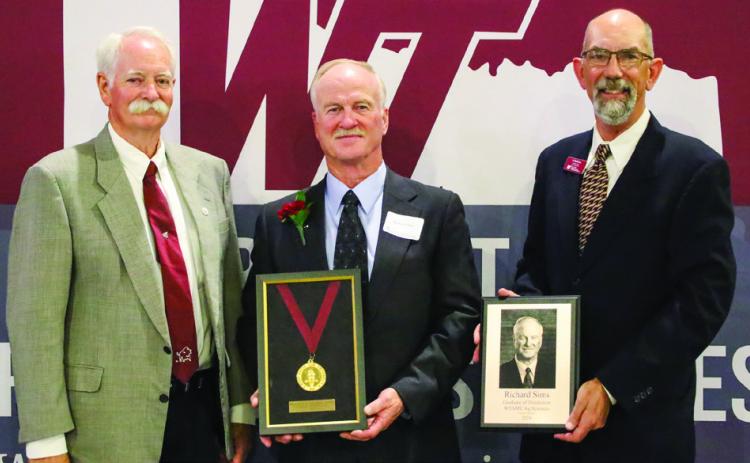 West Texas A&amp;M University (WTAMU) Paul Engler College of Agriculture and Natural Sciences Dean Dr. Kevin Pond, left, and WTAMU Department of Agricultural Sciences Head Dr. David Lust, right, congratulate Wellington’s Richard Sims on his Graduates of Distinction honor bestowed at the recent 2024 WTAMU Ag Day Celebration. Photo Courtesy of WTAMU