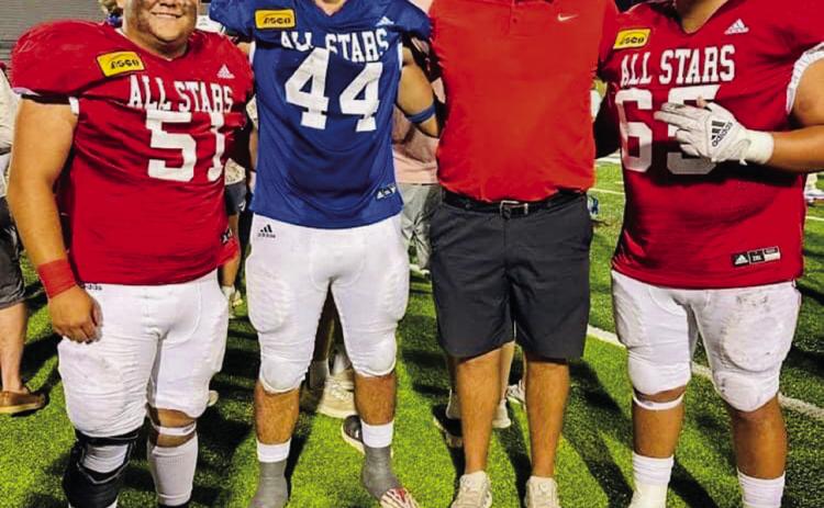 Red Team players Ramon Rodriguez, left, and Fabian Pina, right, celebrate a tie 14-14 game with Blue Team player Ethan Nevarez and Skyrocket Coach Klark Ashmore following the Saturday, June 1 ASCO All-Star 2024 Classic in Lubbock. Courtesy Photo