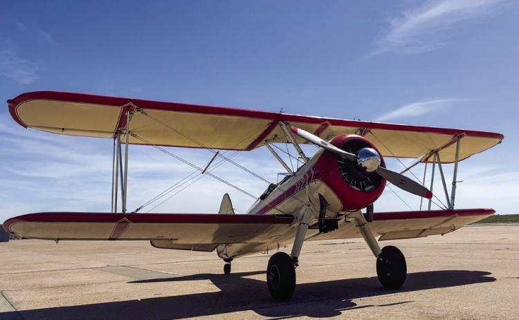 A Boeing Stearman, on its way to an airshow in Dalhart, takes on fuel Friday, May 16 at the Childress Municipal Airport. Tiffany Tully