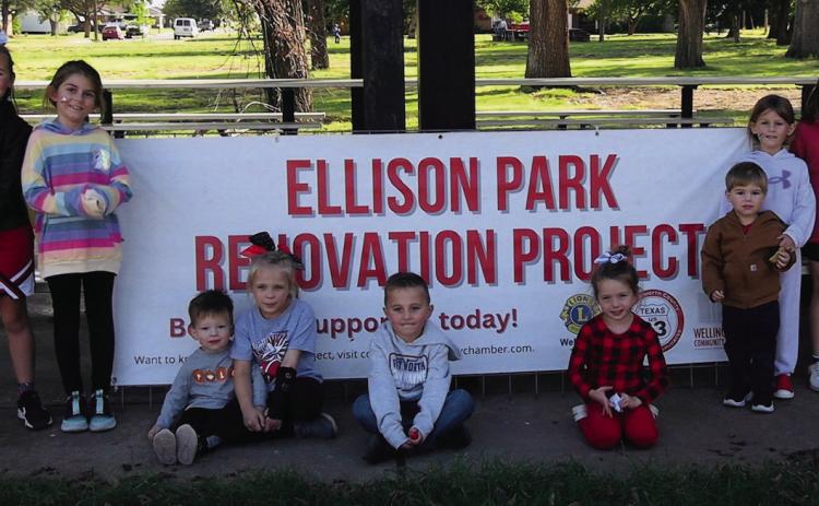 Wellington youth support the Ellison Park Renovation Project with a lemonade stand fundraiser Friday, Oct. 27. The young, community service-minded volunteers raised $461. Organizers and supporters, from left: Rafe Barlow, Jenna Faulks, Bexton Brooks, Hallie Warren, Drake Barlow, Tinlee Cabbell, Levi Faulks, Adeline Faulks, Kodi Cabbell. Photo by Neal Odom