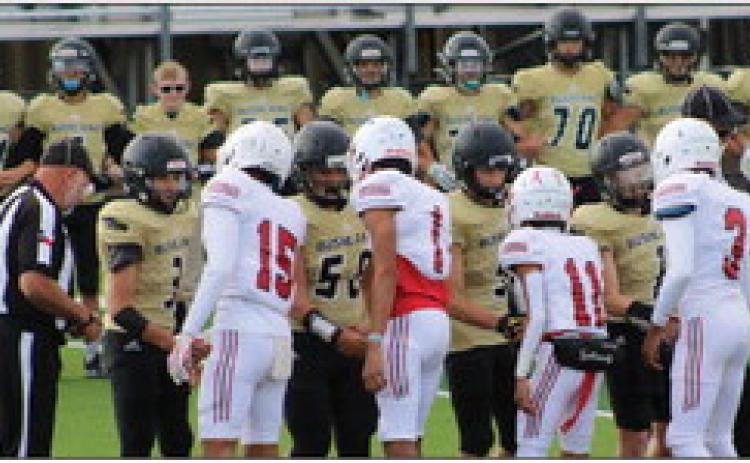 Anthony Ortiz (15), Brenden Garcia (1), TJ Salinas (11) and DeMarcus Lewis (3) serve as junior varsity Skyrocket captains for the Bushland game last Thursday. Wellington tied the Falcons 28-28, leaving the JV Rockets undefeated on the season with one tie game. The Red River Sun/Shauna Salinas