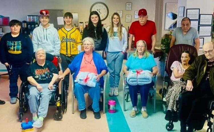 Members of the Wellington Junior High School Student Council Service Committee deliver 40 Operation Blanket Blessing gifts to Wellington Care Center residents Thursday morning, Dec. 21, prior to school dismissal for the Christmas holidays. Students distributing the blankets included Hunter Phipps, Alex Orozco, Lawson Inman, Ansylee Hansen and Anna Needham. Courtesy Photo