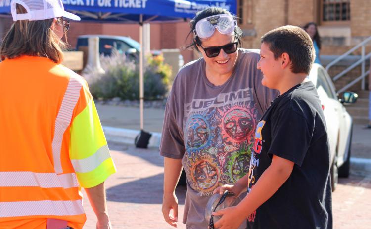 Childress County Heritage Museum Director Niki Seal, along with son Korben, undergoes a field sobriety test while wearing Fatal Vision goggles, which simulate the effects of alcohol impairment, during Childress County Heritage Museum and the Childress District of the Texas Department of Transportation’s Saturdays at the Museum event Saturday, July 26. The Red River Sun/Elizabeth Tanner