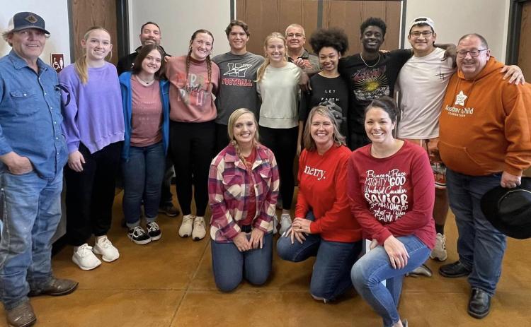Youth gift Home Delivered Meal clients with Christmas joy