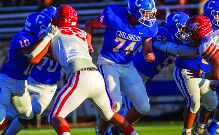 Childress’ Isaiah Jalomo (10), Caleb Mayden (70), Ethan Ferguson (74) and Juan Gonzalez (52) hold the No. 2 Holliday Eagles offensive line during the 28-14 matchup Friday, Sept. 16 at Fair Park Stadium. The Red River Sun/Nicole Dill