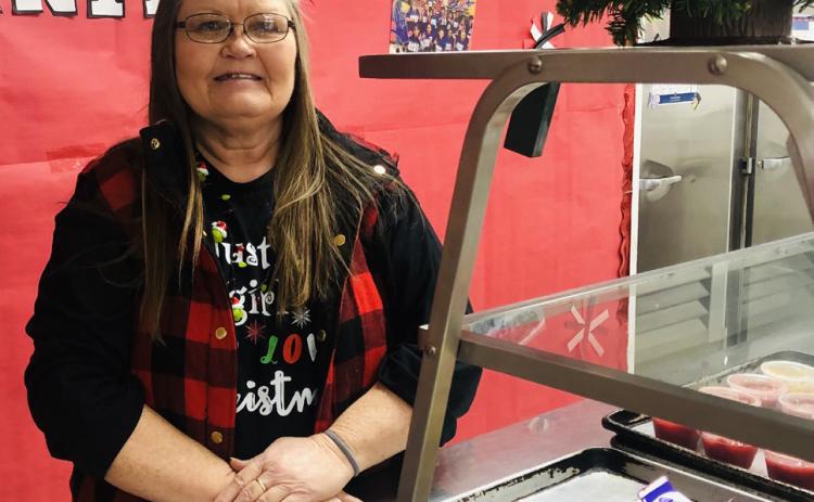 Georgia Brown serves her final meal for Wellington students in the school cafeteria Thursday morning, Dec. 21. The Red River Sun/Bev Odom
