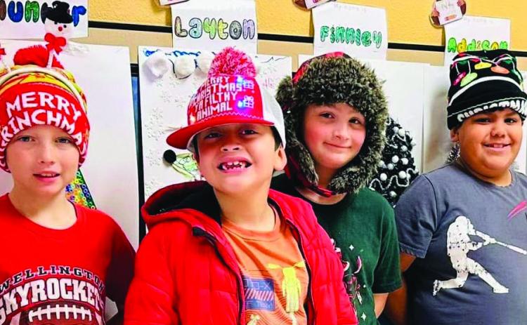 Wellington Elementary School students sport Christmas head gear