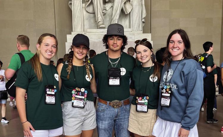 Local high school students visit the Lincoln Memorial during the Texas Electric Cooperatives Government-in-Action Youth Tour. From left: Kendra Bawcom, Wellington High School; Emma Flores, Wellington High School; Riley Lindley, Memphis High School; Meg Ridens, Childress High School; Corbin Daniel, Childress High School. Photos Courtesy of South Plains Electric Cooperative, Inc.
