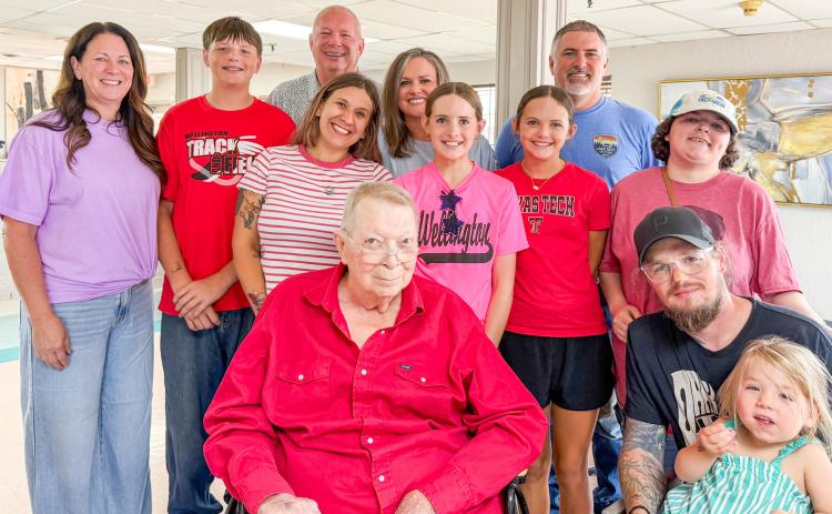 Decked out in his patriotic, Skyrocket-red western shirt, Kent Holland gathers with his family to celebrate an early 80th birthday on Sunday, July 5 at Wellington Care Center. From left: Camie, Carson, Chad and Sarandon Holland; Carly, Blair, Berkeley and Brandon Ward; Taylor, Chase and Margo Holland. COURTESY PHOTO
