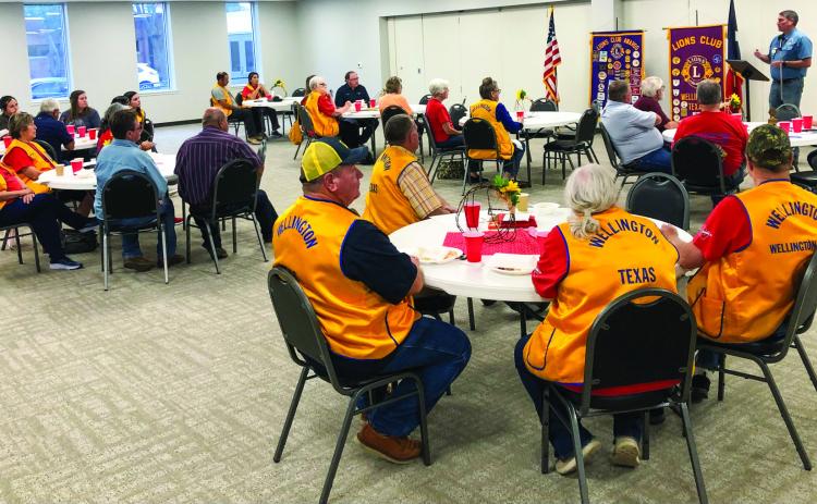Guests and members of the Wellington Lions Club listen as District 2-T1 Lions Governor Chris Rogers describes district priorities at its Monday, Sept. 16 meeting The Red River Sun/Bev Odom
