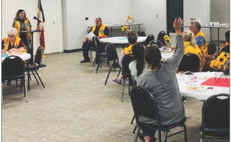 Lion Margret Wood describes upcoming events during the Monday, Sept. 4 meeting of the Wellington Lions Club back in the Club Room of the renovated Bura Handley Community Building. The Red River Sun/Bev Odom
