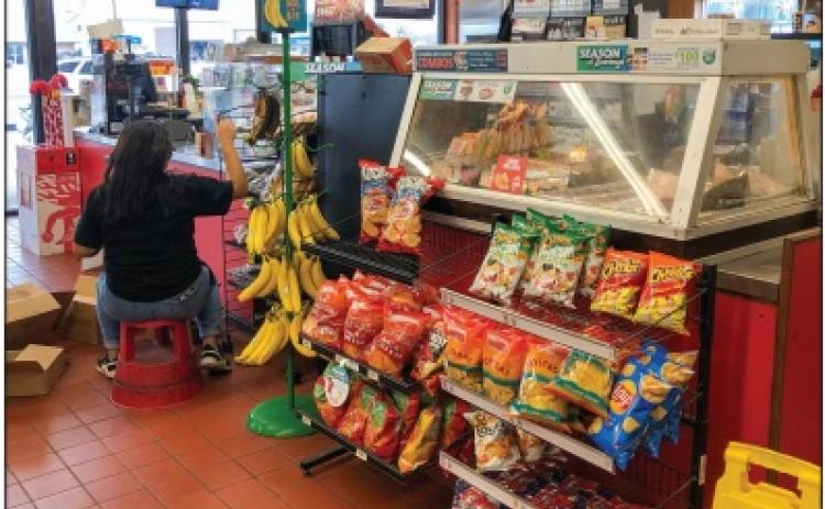 Armed Allsup’s robber escapes on foot