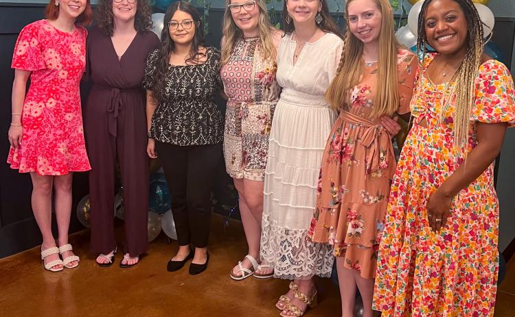 Wedding attendants and friends surround honoree Grace Kiker at her bridal shower on Saturday morning, June 7 at the downtown Wellington Lewis Building. From left: Victoria Kiker, Jalee Davis, Victoria Sanchez, Megan Manning, guest of honor Grace Kiker, Sarah Chadwick and Kira Mickens.