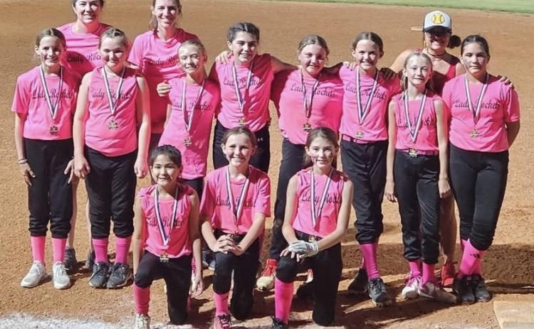 The first year for seven of the Lady Rockets to play softball, one mom described the girls as growing tremendously from game one to the last game and falling in love with the sport. Front row, from left: Juliet Solis, Raylie Sims, Peyton Roberson. Second row, from left: Blair Ward, Presley Kemp, Calleigh Henard, Quinn Roberson, Hadlee Patterson, Berkeley Ward, Cora Henard, Sara Morris. Back row, from left: Statistician Tana Roberson, Coach Molly Sims, Coach Lauren Patterson.