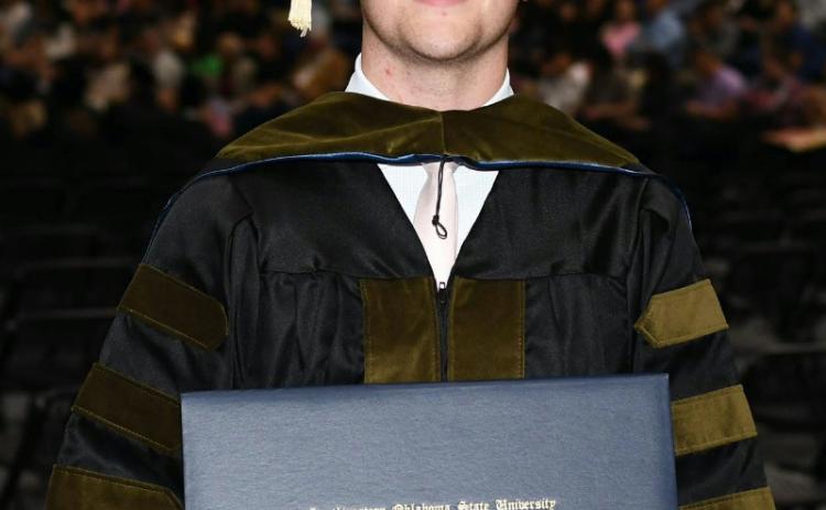 Cory Bodine, of Quanah, accepts his Doctor of Pharmacy Degree from Southwestern Oklahoma State University.