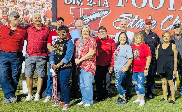 The Wellington High School Class of 1985 celebrates its 40th class reunion in conjunction with the 2025 Skyrocket homecoming football game. Front row, from left: Brenda Powell Brown, Lori Lacy Gillem, Becky Sanchez Hinojosa, Carmen Garcia Henson, guest Mrs. Tony Molina. Back row, from left: Brian Wilbur, James Benton, Jerry Dan Davis, Jamie McKay, Dell Davis, Chris Hayes, Michael Souder, Tony Molina.