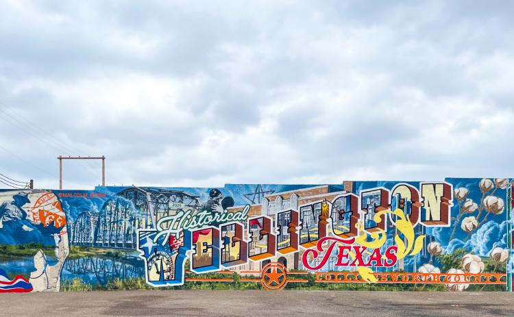 Commissioned by the Wellington Community Fund, depicting Collingsworth County and Wellington history, muralist Malcolm Byers presents his final mural design, finishing the last spray paint stroke around 12:30 p.m. Friday, Sept. 5 at 915 West Ave.