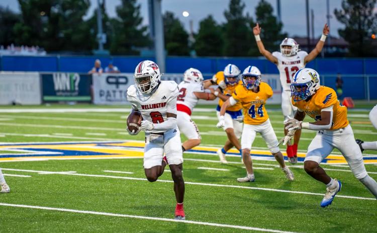 Wellington’s Kamron Brooks (8) amasses 105 receiving yards and two touchdowns during the Skyrockets’ 44-22 on-the-road victory over Lubbock Christian last Friday night, Sept. 19 at Masked Rider Capital Field. Senior Gustavo Soto (22) fends off the Eagles, while junior quarterback Callen Kane (12) completed 16-of-24 passes for 177 yards and four touchdowns.