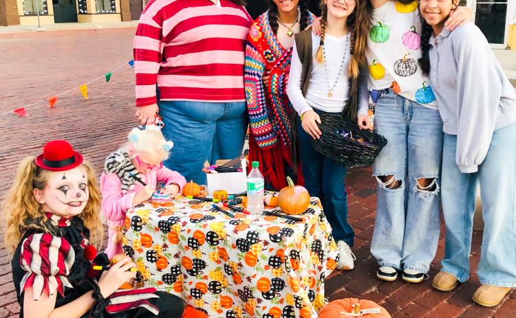 The Henard sisters share their homegrown 2025 pumpkin crop with Collingsworth County Chamber of Commerce Trunk-or-Treaters on the south side of the downtown square from 5:30-7 p.m. Thursday, Oct. 30. Visitors chose a mini pumpkin and painted the keepsake treat. From left: Aubree Richard, Blake Lemons, Rileigh Henard, Seveyah Pena, Evelyn Henard, Anna Henard, Aundrea Garcia.