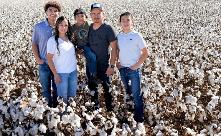 Bawcom Farms harvested the first bale of the 2025 cotton crop, ginned on Friday, Oct. 10, at Farmers Cooperative Society #1 in Wellington. Representing Bawcom Farms is Tino Salinas, the farming entity’s sole farmhand, and his family. From left: TJ, Shauna, Alejandro, Tino and Dahmian Salinas.