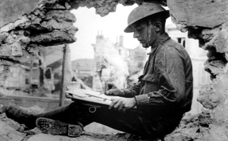 A soldier writes letters home during the war.