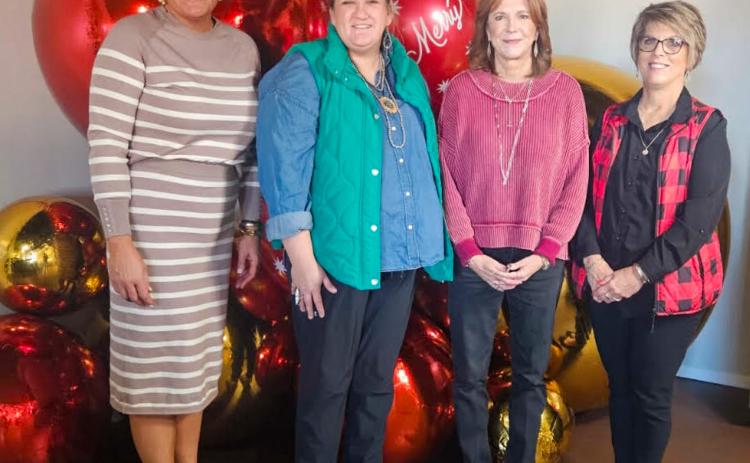 Host Brooke Carter, left, with Hearts United Give Support (HUGS) volunteers Whitney Wiebe, Marcy Sessions and Donnie Carter, welcome visitors for the Holiday Home Tour on Sunday afternoon, Dec. 7.