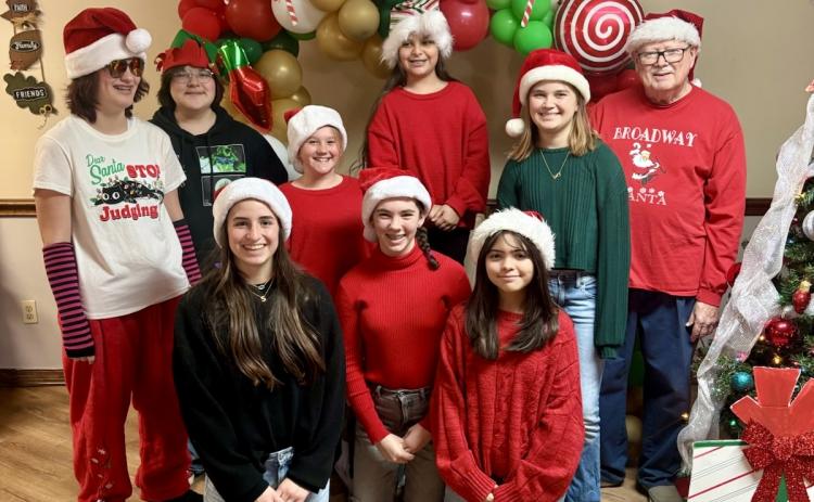 Monson Music Studio students perform at Childress Healthcare Center and Cottage Village of Childress Friday, Dec. 19, performing 19 Christmas selections. From left: Remi Jones, of Childress, guitar; Lani Wyatt, of Paducah, guitar; Saylee Ochoa, of Childress, guitar and vocals; Kinzlee Willis, of Childress, vocals; Libby Sanford, of Childress, vocals; Avery Lopez, of Childress, vocals; Emmelia Butler, of Quanah, guitar and vocals; Chelsea Harms, of Wellington, violin and vocals; and Monson Music Studio owner