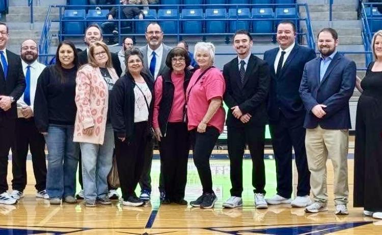 The Childress Bobcat Basketball Program donates over $850 to We Can Care, a local nonprofit organization aiding Childress County cancer patients, Tuesday, Jan. 20 during the Childress vs. River Road matchup at Bobcat Den in Childress. Funds were obtained through the purchase of $1 paper sneakers during Coaches vs. Cancer Suits and Sneakers Week, a nationwide event when basketball coaches across the country unite for a common cause—ending cancer as we know it.