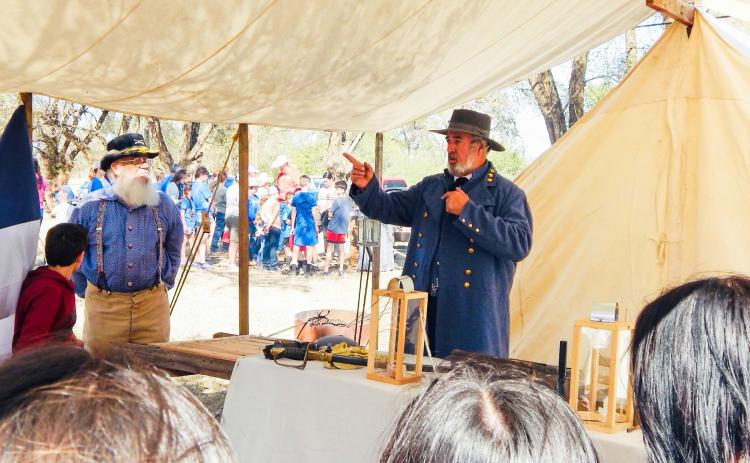 Assisted by organizer Darrell Colson, Steven Boone, reenacting Confederate General Robert E. Lee, explains life during the American Civil War to area students during the 2024 Living History Weekend at Powell Park in Wellington. Hosted by the Sons of Confederate Veterans Charles Goodnight Frontier Reg. Camp #2280, the 2025 event will again take place Friday-Saturday, Oct. 3-4 at Wellington’s Powell Park on Hwy 83. The Red River Sun/Bev Odom