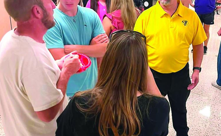 New Memphis High School Principal John Odgen (in gold shirt) met with students and parents Tuesday evening for a What’s The Scoop ice cream meet and greet. MISD PHOTO