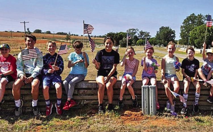 Collingsworth 4-H places cemetery flags