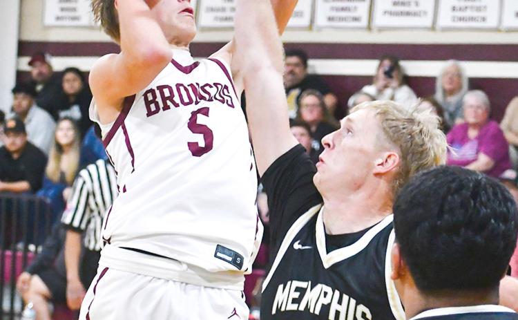 Memphis’ Ethan Perkins and Andres Rodriguez block out the Clarendon Broncos in a 62-45 win Tuesday, Jan. 13 in Clarendon, coming back off a two-game losing streak. Adelita Elam