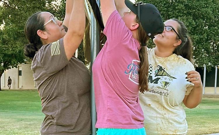 Memphis Cyclone Boosters decorate street signs to boost school spirt and show support for local athletes. COURTESY PHOTO
