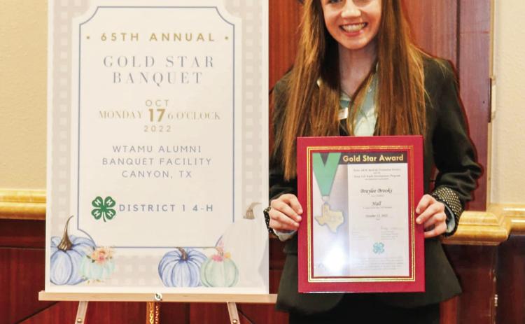 Hall County 4-H member Braylee Brooks earns the Gold Star Award, the highest achievement given by the Texas 4-H Youth Development Program, at the 65th Annual District I 4-H Gold Star Banquet Monday, Oct. 17 at the West Texas A&amp;M University Alumni Banquet Facility in Canyon. Photo Courtesy of Hall County 4-H