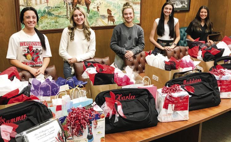 Miss Wellington Summer Owens, left, first runner-up Harlee Gomez, second runnerup Madeleine Kane, third runner-up Gracie Lampe and fourth runner-up Arianna Pena receive their gift bags of goodies in the conference room of Wellington State Bank Thursday, Oct. 20. Courtesy Photo