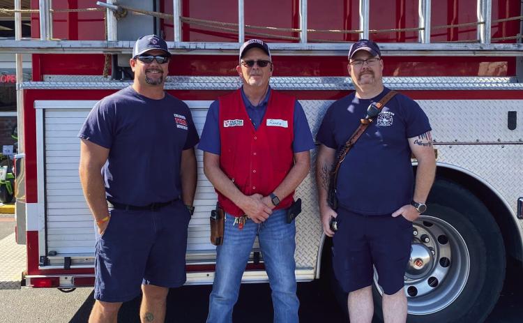 Childress Firefighters Justin Willis, left, and Justin Westmoreland, right, recently thank Tractor Supply Co. employee Randy Wadley, center, for a discount on a pump for Tanker No. 2. “Thank you, Tractor Supply and Randy Wadley for giving us a huge discount,” Childress Fire Department said. “We greatly appreciate it.” Photo Courtesy of Childress Fire Department