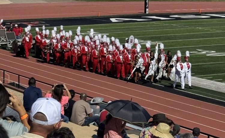The Rocket Regiment enters the field for its performance at the UIL Region 1 Marching Contest Saturday, Oct. 18 at Dick Bivins Stadium in Amarillo, earning an overall Division 2 rating. See page 4B for additional photos. Wellington High School