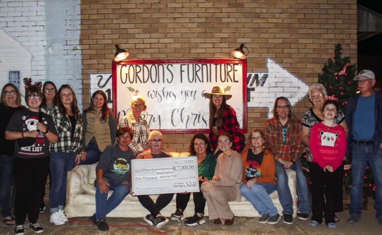 Childress Farmers Market makes donation to Childress Downtown Historical Association during evening finale
