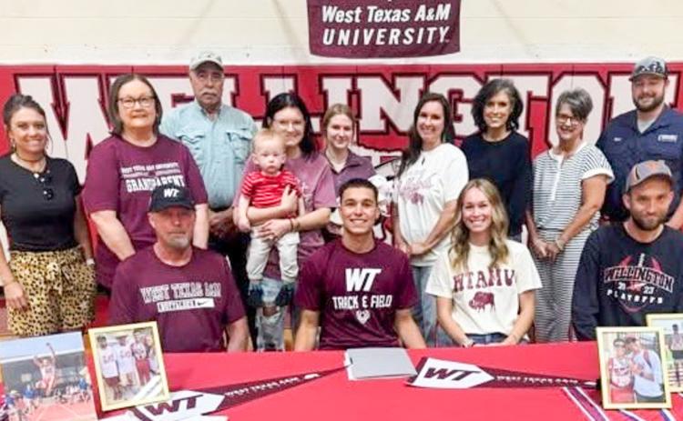 Surrounded by his family, Wellington High School senior Major Brown signs his National Letter of Intent to continue his track and field career at West Texas A&amp;M University Thursday, April 23. Front, from left: his dad, Daryon Brown, M. Brown, sister Marlee Brown Killian, brother Nathan Brown. Back row, from left: Lauren Patterson, Marie White, Pat White, Boone and Emily Cummings, Addisyn and Landree Wood, Leslee Wood, Lesa Thornberry, Cathy Needham, Matt Needham.